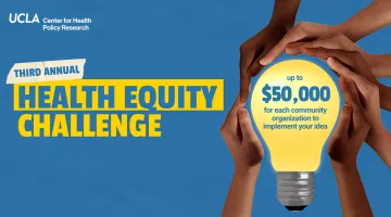 hands holding a lightbulb highlighting 50K prize for the Health Equity Challenge